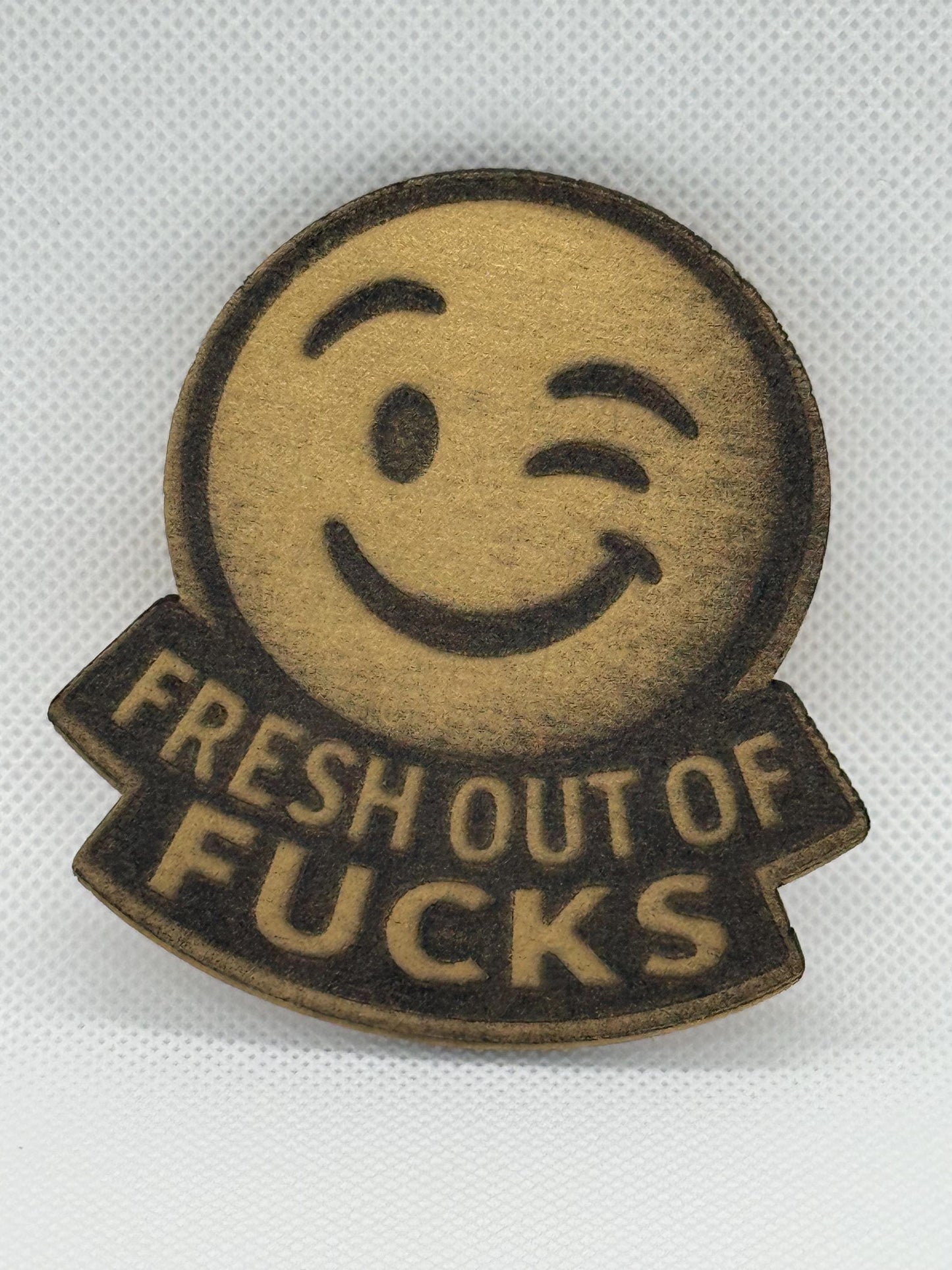 Fresh Out of Fucks Winking Laser Engraved Emoji Magnet