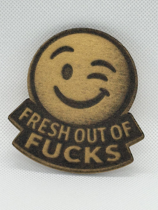 Fresh Out of Fucks Winking Laser Engraved Emoji Magnet